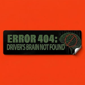May include: Black rectangular sticker with the text "ERROR 404: DRIVER'S BRAIN NOT FOUND" in green, stylized font. A green brain graphic with a red "no entry" symbol is on the right. The sticker is on an orange background.