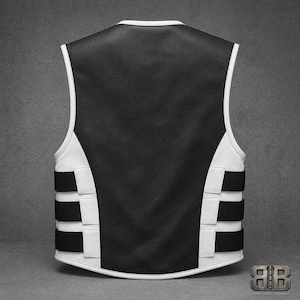 Back view of a white and black leather motorcycle vest with a large black perforated back panel and three adjustable side straps.