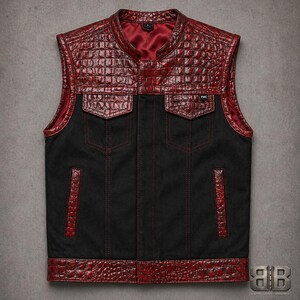 Front view of a black motorcycle vest with red croc-textured upper panels, flap chest pockets, welt pockets and red stitching.