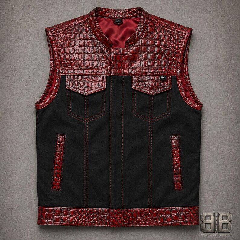 Front view of a black motorcycle vest with red croc-textured upper panels, flap chest pockets, welt pockets and red stitching.
