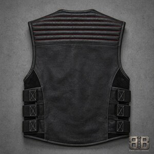 Back view of a black leather motorcycle vest with horizontal padded upper panel, large plain back panel and three adjustable side straps.