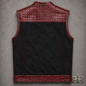 Back view of a black motorcycle vest with red croc-textured shoulder panel, armhole trim and matching bottom band.