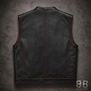 Back view of a black biker vest with red contrast stitching, vertical seam detailing and a straight hem band.