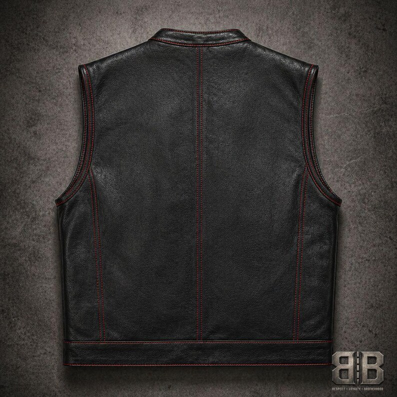 Back view of a black biker vest with red contrast stitching, vertical seam detailing and a straight hem band.