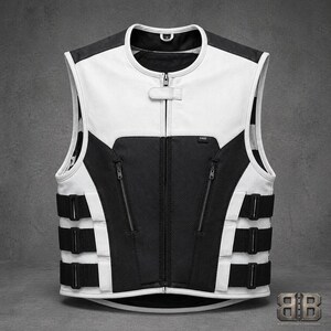 Front view of a white and black leather motorcycle vest with contrasting panels, center zipper, two zip pockets and three adjustable side straps.