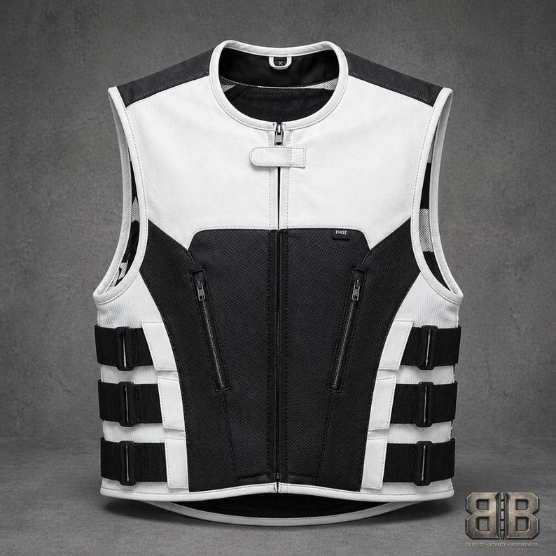 Front view of a white and black leather motorcycle vest with contrasting panels, center zipper, two zip pockets and three adjustable side straps.