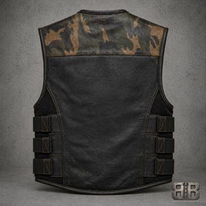 Back view of a black motorcycle vest with a camouflage shoulder panel and three adjustable side straps.