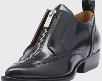 Mocasines Chloé con cremallera frontal, piel negra, punta afilada, talla EU 37 (equivalente a 36.5), de diseño sin cordones.