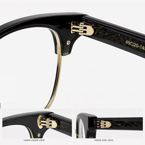 May include: Black spectacles featuring a gold-tone metal hinge and a thin gold-tone lower rim. The inner temple arm displays the text 49 20-145. The design includes a glossy black frame with a visible screw and a textured pattern on the inner arm.