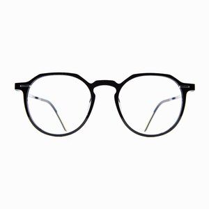May include: Black round-frame eyeglasses with clear lenses. The glasses have a thin, minimalist design with a bridge connecting the two lenses. The temples are thin and extend to the ear. The glasses are set against a white background.