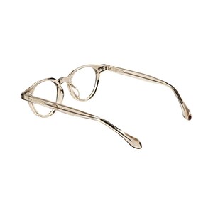 May include: Clear, round-framed eyeglasses with a light brown tint. The glasses have a classic design with thin temples and a keyhole bridge. The frames are made of a translucent material, and the lenses are clear.
