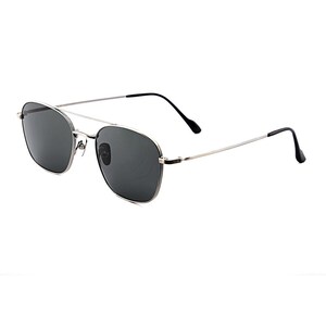 May include: Silver-toned metal frame sunglasses featuring a double bridge design and dark gray tinted lenses. The thin temples are finished with black plastic tips, providing a sleek and functional look for these classic aviator-style eyewear.