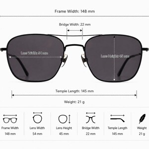 May include: Black sunglasses with a double bridge design and dark lenses. Technical specifications are labeled: frame width 148 mm, bridge width 22 mm, lens width 54 mm, lens height 45 mm, temple length 145 mm, and a total weight of 21 grams.
