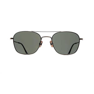 May include: Sunglasses with a thin black metal frame and a double bridge design. The lenses are a dark grey-green tint. The frame features adjustable nose pads and slim temples, providing a structured look with a classic navigator-inspired shape.
