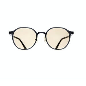 May include: Round glasses with a thin black frame and light beige tinted lenses. The eyewear features a bridge connecting the two circular rims and thin temples extending from the sides. The design is simple, focusing on the dark frame and lenses.