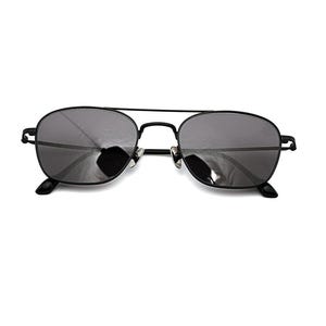 May include: Black metal frame sunglasses featuring a double bridge design and dark grey tinted lenses. The eyewear has thin, minimalist temples and adjustable nose pads, providing a sleek and functional look for eye protection against sunlight.