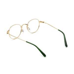 May include: Gold-rimmed eyeglasses with a classic round frame design. The temples are a contrasting dark green color. The glasses are shown against a white background.