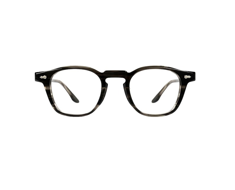 May include: Round-framed eyeglasses with a dark gray and black striped pattern. The glasses have a keyhole bridge and small silver accents on the temples. The lenses are clear.