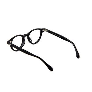 May include: Black eyeglasses with round frames. The glasses have a matte finish and a sleek, modern design. The temples are thin and curve gently towards the ear. The text on the temple reads: LENOX 60 50033 - 147 COL. E.