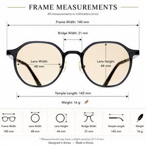 May include: Black-rimmed glasses with light amber lenses. A diagram displays measurements: 140 mm frame width, 21 mm bridge width, 48 mm lens width, 44 mm lens height, 142 mm temple length, and a weight of 16 g. Text includes FRAME MEASUREMENTS.