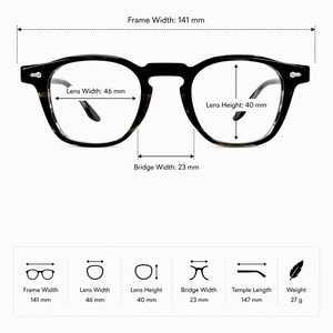 May include: Black eyeglasses with a frame width of 141 mm, lens width of 46 mm, lens height of 40 mm, and bridge width of 23 mm. The temple length is 147 mm, and the weight is 27 g. The glasses have a classic, rounded shape.