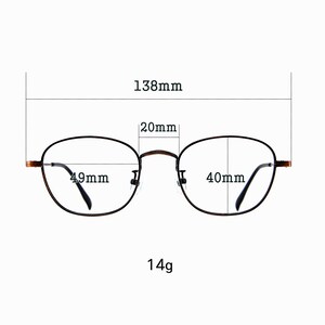 May include: Oval-shaped spectacles with a dark brown frame. The glasses measure 13.8cm wide, with individual lens widths of 4.9cm and 4cm. The bridge width is 2cm, and the glasses weigh 14g.
