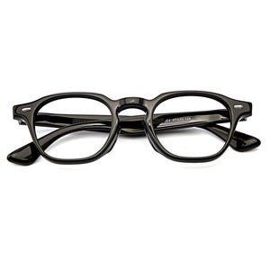 May include: Glossy black acetate eyeglasses featuring a rounded rectangular frame shape with silver-toned metal rivets at the hinges. The inner temple arm displays the text C1 47 23-148, indicating the frame measurements in millimeters.