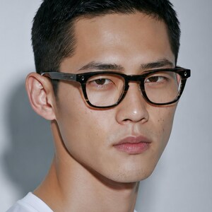 May include: Full-rim eyeglasses featuring a dark brown and black tortoiseshell pattern frame with a rectangular shape. The glasses have silver-toned metal accents on the outer corners of the frame front and a clear lens design.