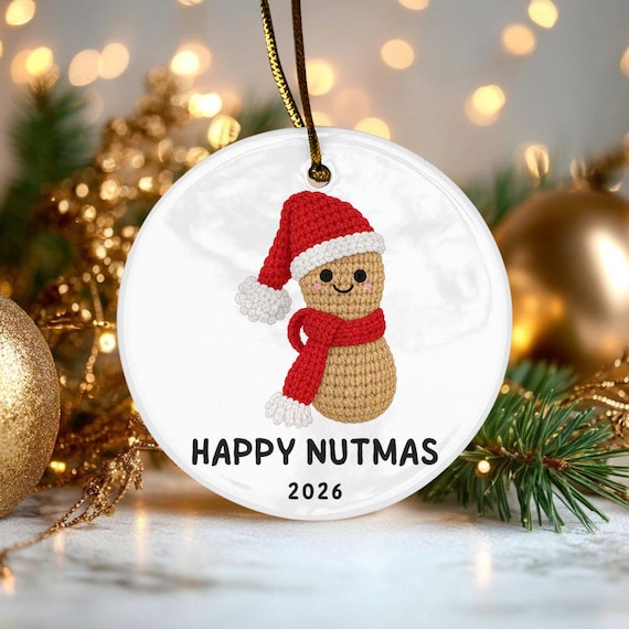 A ceramic peanut ornament with a crochet-style texture that says 'Happy Nutmas' — genuinely silly, specific, and the kind of thing that wins a white elephant exchange.