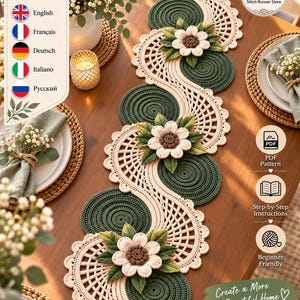 May include: A crochet table runner featuring a serpentine design with alternating dark green circular motifs and cream-coloured lattice sections. Three dimensional cream flowers with brown centres and green leaves are attached to the runner.