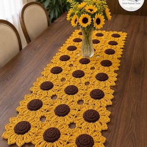 May include: A rectangular table runner crafted from interconnected crochet sunflower motifs. Each sunflower features a dark brown circular center surrounded by bright yellow petals. The runner is laid out flat, showcasing a repeating floral pattern.