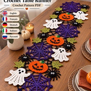 May include: A Halloween crochet table runner pattern PDF featuring orange jack-o'-lanterns, white ghosts, purple spider webs, black spiders, and green leaves. The text reads Halloween Crochet Table Runner Crochet Pattern PDF with language options.