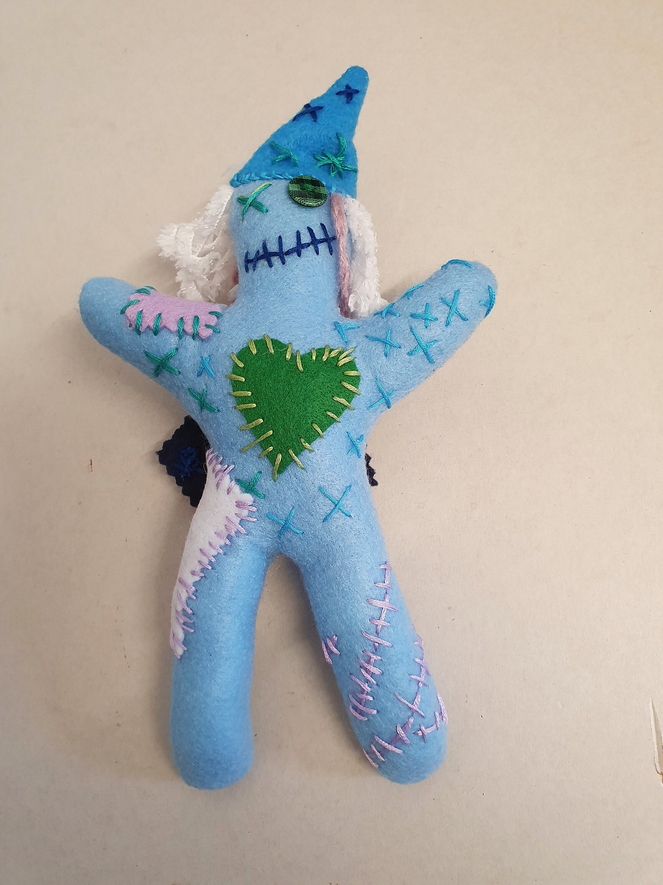 blue voodoo doll