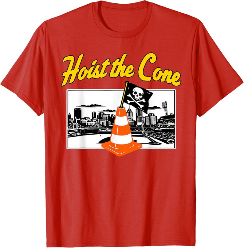 May include: Red t-shirt with the phrase "Hoist the Cone" in yellow lettering. The shirt features a graphic of a traffic cone with a skull and crossbones flag in front of a city skyline.