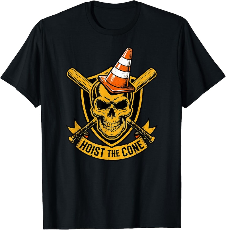 May include: Black t-shirt featuring a yellow skull wearing an orange and white traffic cone. Crossed baseball bats and axes flank the skull, with the text "HOIST THE CONE" below. A unique graphic tee.