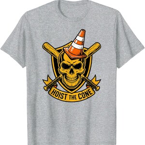 May include: A gray t-shirt featuring a graphic design. The design includes a yellow skull wearing an orange and white traffic cone, with crossed baseball bats and axes. The text "HOIST THE CONE" is displayed on a banner.