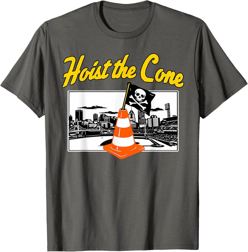 May include: Dark gray t-shirt with a graphic featuring an orange and white traffic cone with a skull and crossbones flag, set against a cityscape. The text "Hoist the Cone" is in yellow above the graphic.