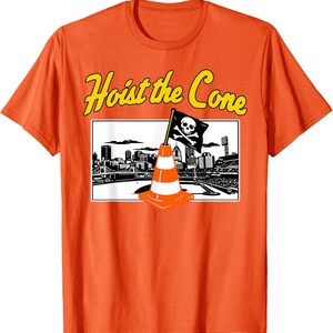 May include: Orange t-shirt with the phrase "Hoist the Cone" in yellow lettering. The shirt features a graphic of a traffic cone with a skull and crossbones flag in front of a city skyline.