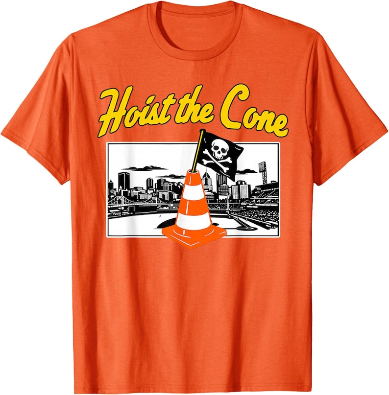 May include: Orange t-shirt with the phrase "Hoist the Cone" in yellow lettering. The shirt features a graphic of a traffic cone with a skull and crossbones flag in front of a city skyline.