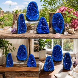 May include: A collection of vibrant blue geode crystal specimens featuring deep cobalt crystalline interiors and dark outer rock shells. These pointed, upright mineral formations are displayed in various sizes, showcasing natural jagged textures.