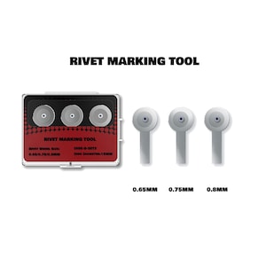 May include: A rivet marking tool set featuring a rectangular red and black case with three circular wheels and three separate metal marking attachments. The text reads RIVET MARKING TOOL, RIVET WHEEL SIZE: 0.65/0.75/0.8MM, DISK-B-SET3, DISC DIAMETER:15MM.
