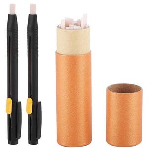 May include: Two black mechanical erasers with yellow accents and a cylindrical orange container filled with eraser refills. An additional empty orange container is also present. The erasers are designed for precision and detail work.