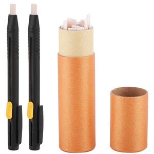 May include: Two black mechanical erasers with yellow accents and a cylindrical orange container filled with eraser refills. The container is open, revealing the pink eraser pieces. A separate orange tube is also shown.
