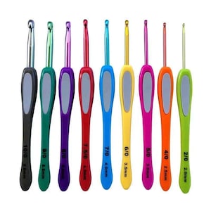 May include: A set of nine crochet hooks with ergonomic handles in various colors. Each hook has a silver metal tip and a colored handle with a gray grip. Sizes range from 2.0mm to 8.0mm, indicated on each hook.