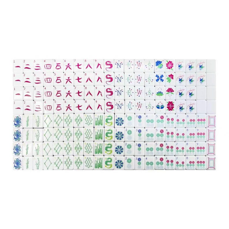 May include: A complete set of white mahjong tiles arranged in a grid, featuring various colorful engraved symbols including numbers one through nine, directional letters, flowers, dragons, bamboo stalks, and joker tiles with blue and pink accents.