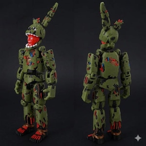 May include: Two-view image of a green action figure with a rabbit-like head and exposed red interior. The figure has a tattered appearance with visible red and blue accents, and is posed against a dark background.