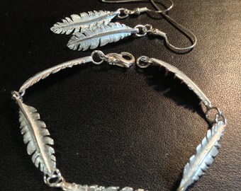 Original silver feather bracelet and left and right feather earrings
