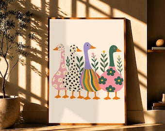 May include: A framed wall art print featuring four stylized ducks standing in a row. The first duck is pink with white daisies, the second is white with black spots, the third has multicolored vertical stripes, and the fourth is pink with large green flowers.