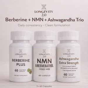 May include: Three white supplement bottles labeled "Berberine Plus", "NMN & Resveratrol", and "Ashwagandha Extra Strength". The bottles have white caps and are labeled "Longevity 2.0". The text "Berberine + NMN + Ashwagandha Trio" is above the bottles.