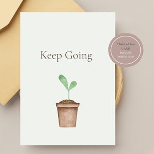 May include: A white greeting card featuring the text Keep Going in dark gray font above a watercolor illustration of a small green sprout in a brown terracotta pot. The card is positioned next to a light yellow envelope and a circular badge.